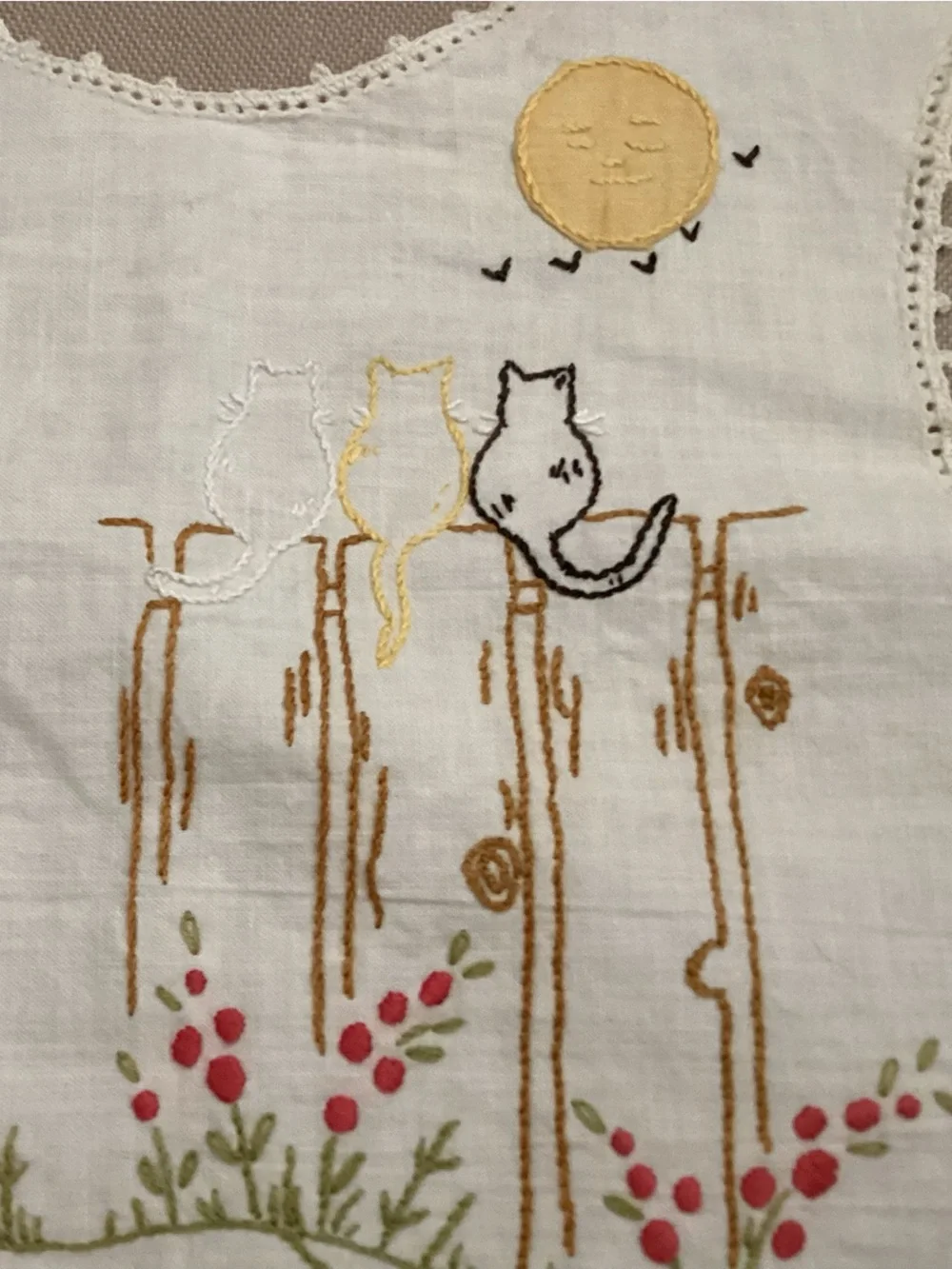 Antique hand-made embroidered linen baby bib featuring a lg. grey cat